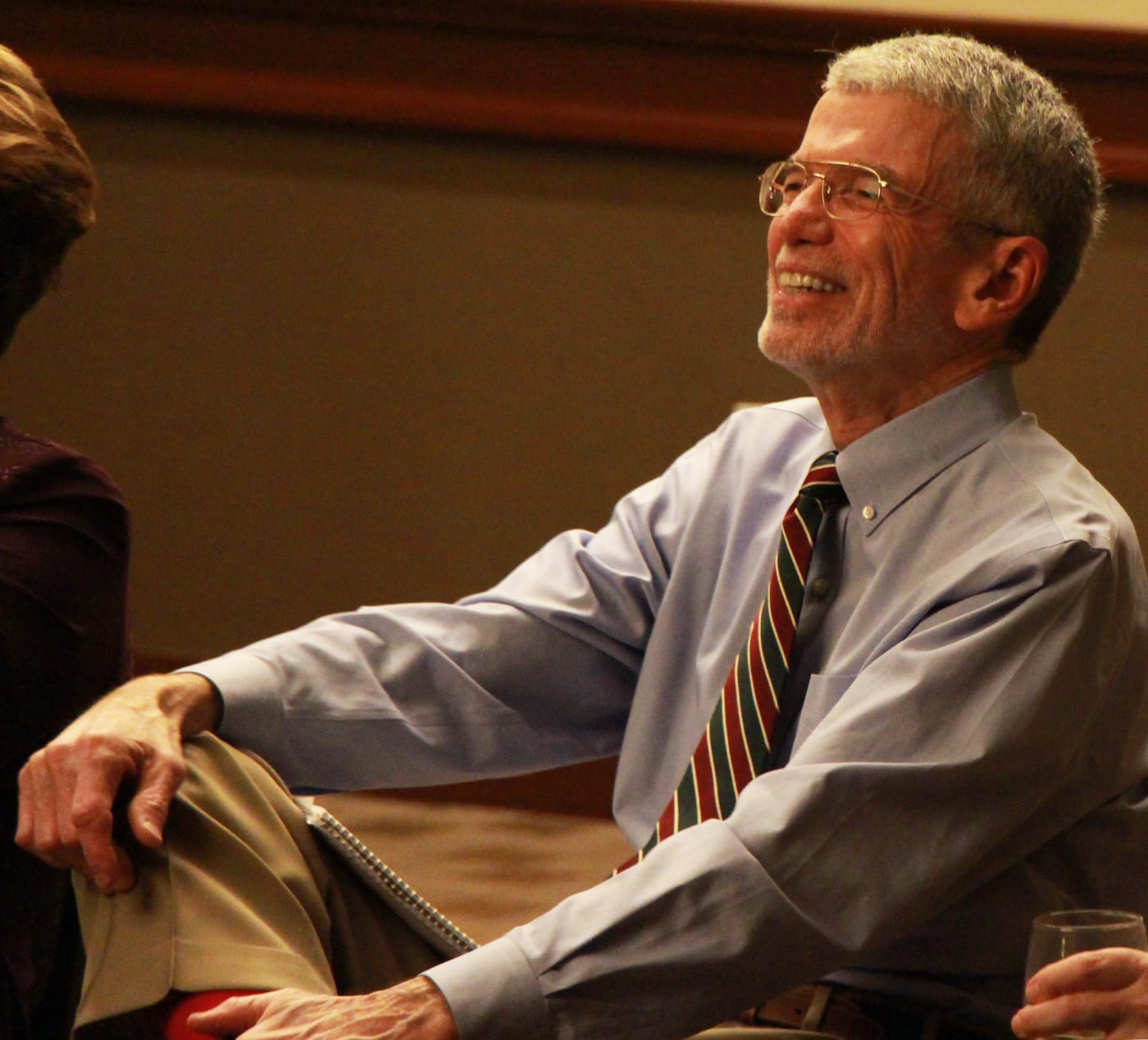 Paul Thornton smiling and listening at an event